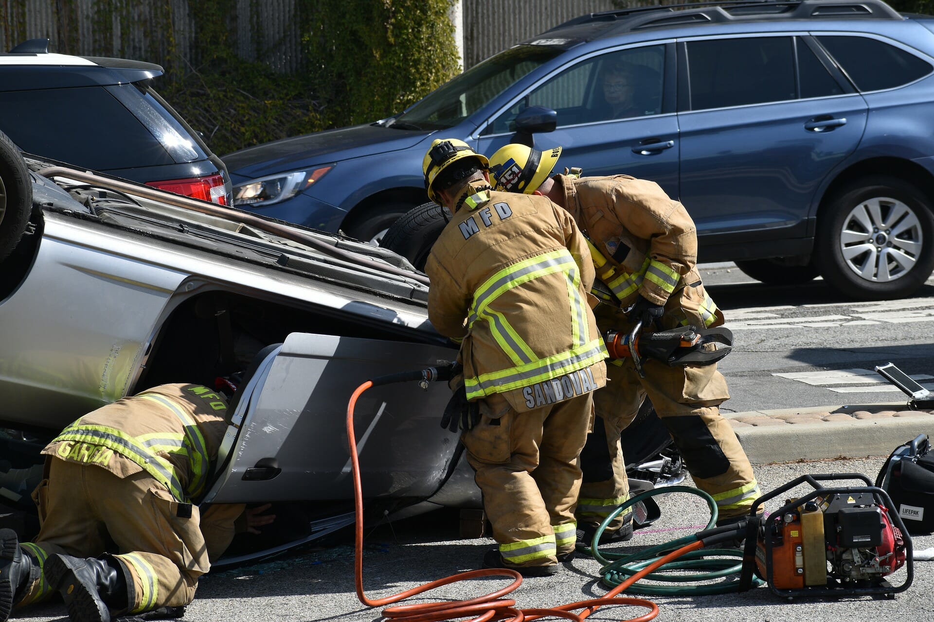 car accident kelly drive Philadelphia - firemen removing victim from car.